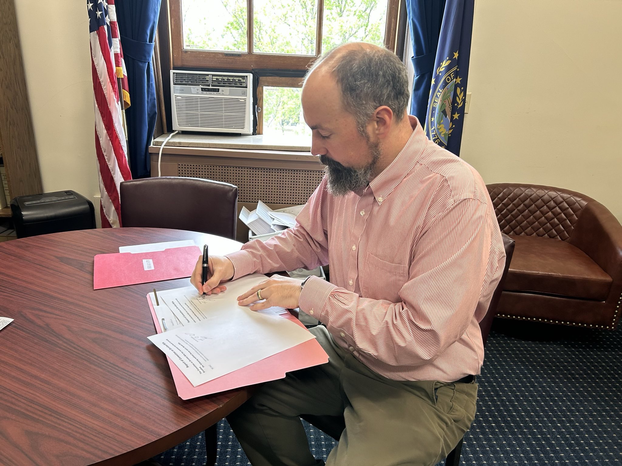 Jason Osborne signing legislation
